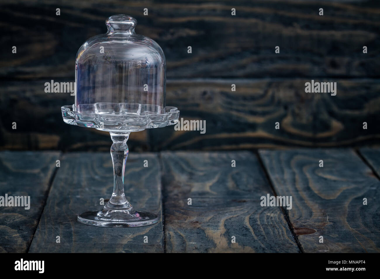 Decorative glass bell on blue wooden background Stock Photo Alamy
