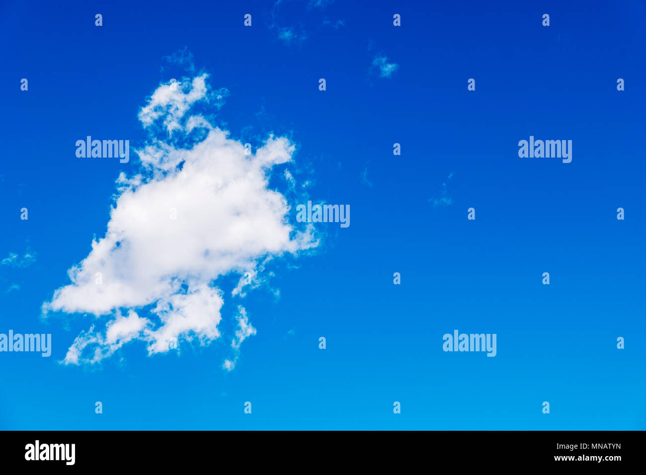 Puffy white clouds against a clear azure blue Colorado sky. Stock Photo