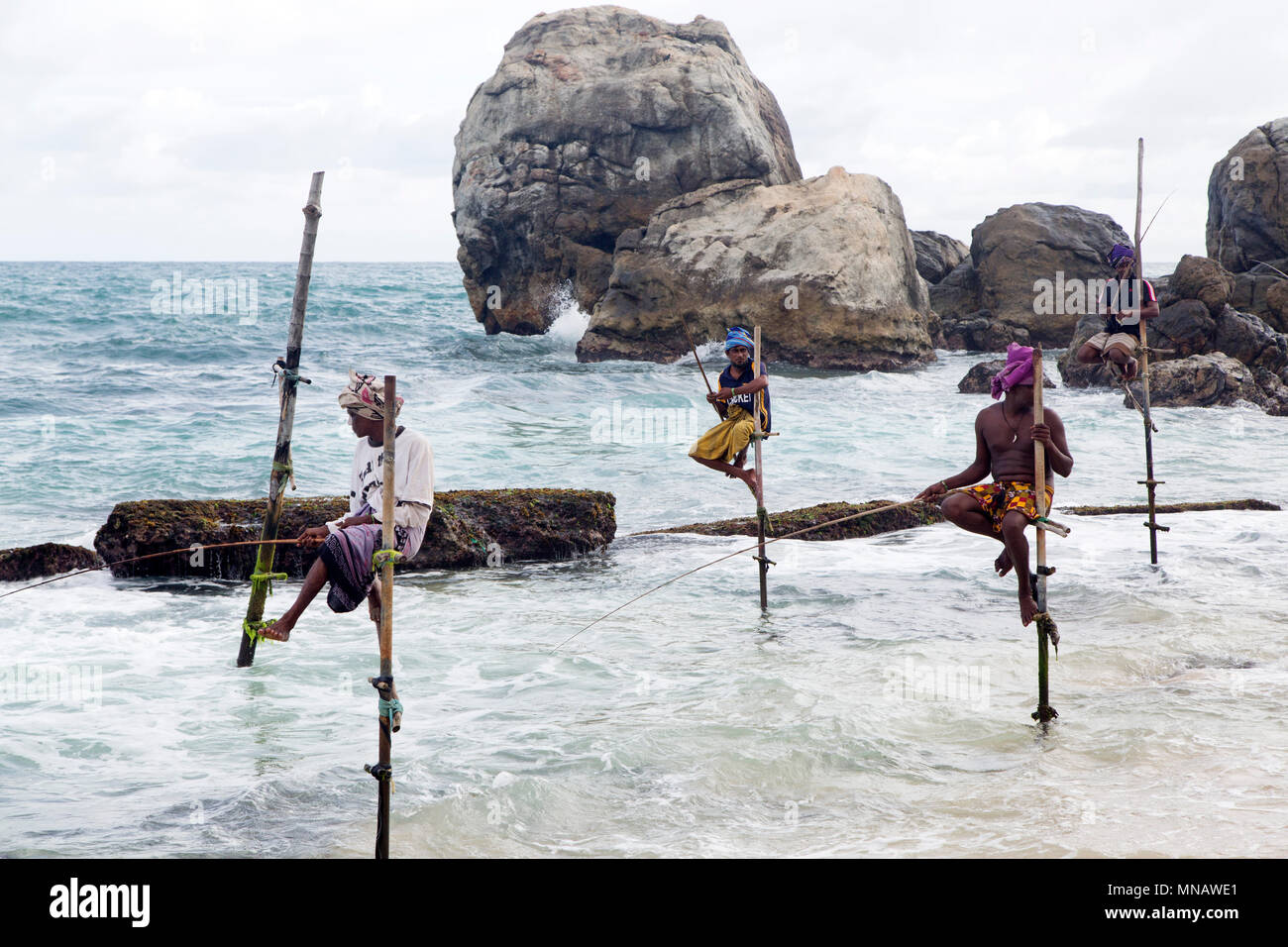 Stilt fishermen near Galle in Sri Lanka. The men fish in the Laccadive