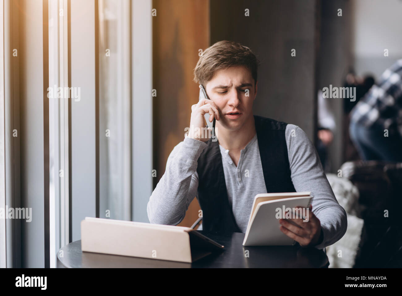 Young man with tablet pc computer at cafe Stock Photo