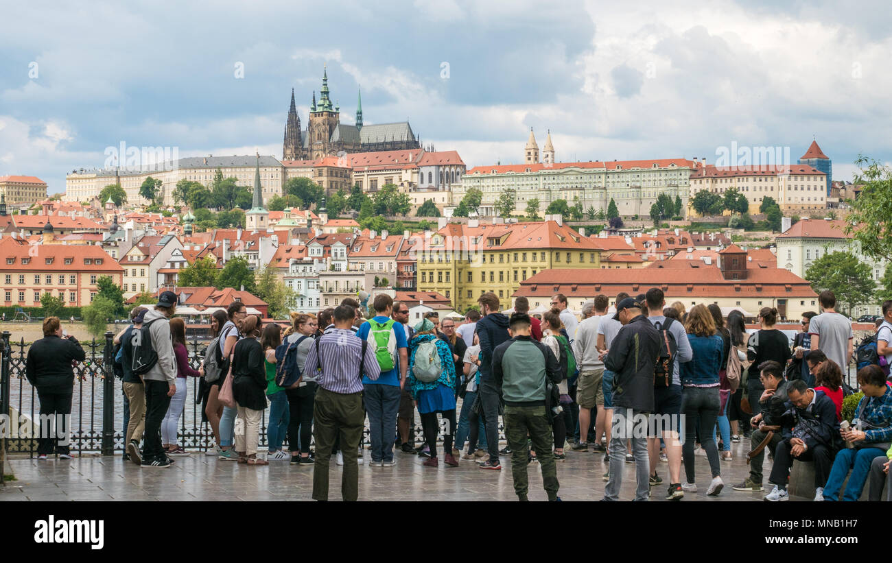 Tourists jostling for a view of the Prague Castle complex on the other side of the Vltava river, Czech Republic Stock Photo