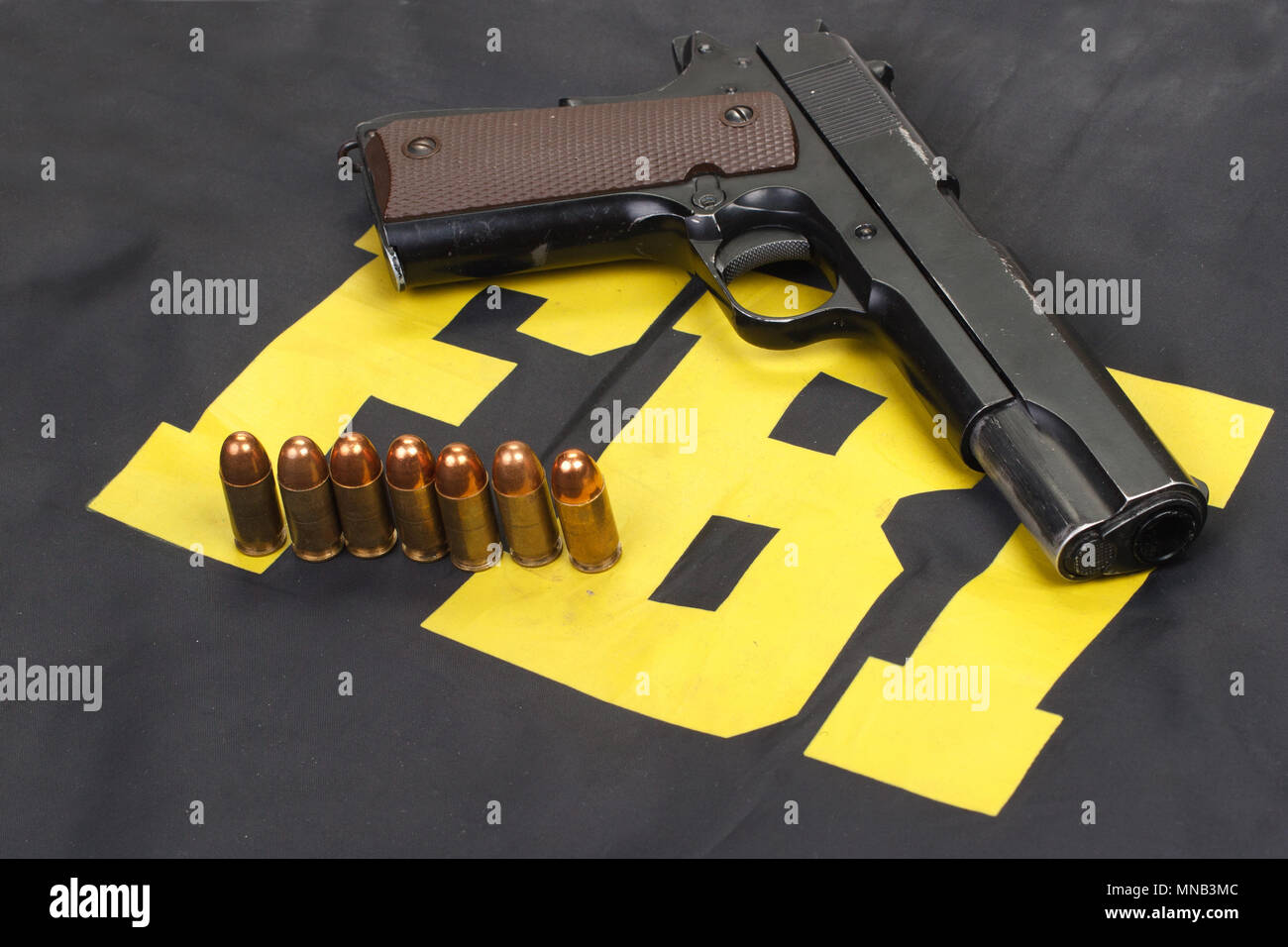 colt government m1911 handgun with ammo on fbi uniform Stock Photo Alamy