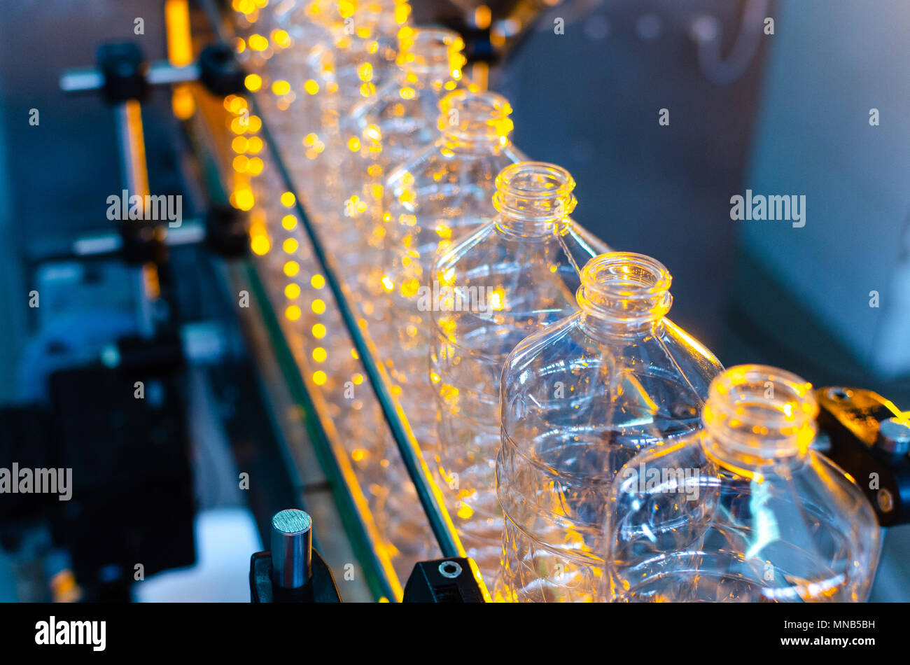 Bottle. Industrial production of plastic pet bottles. Factory line for