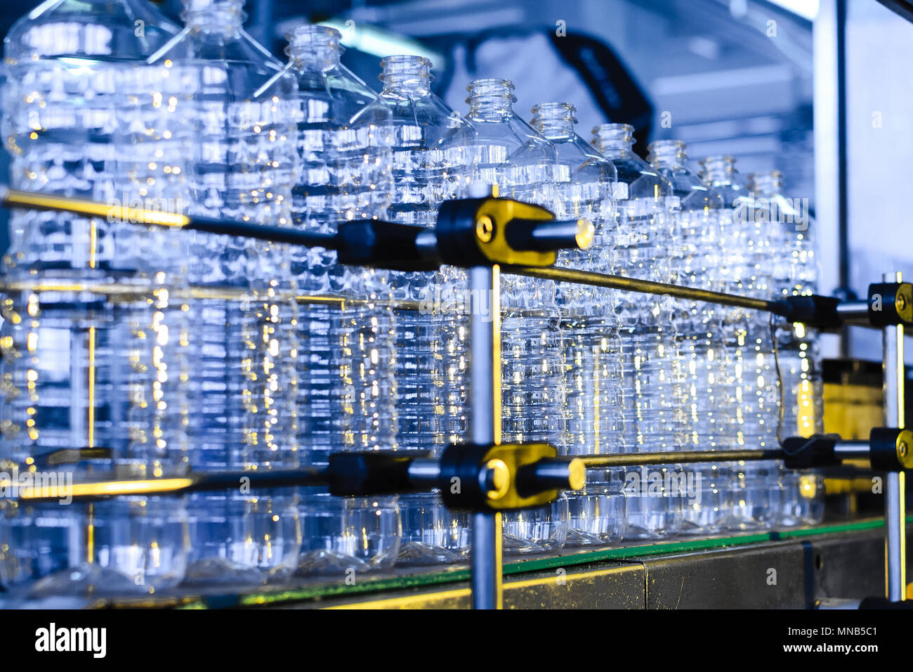 Bottle. Industrial production of plastic pet bottles. Factory line for ...