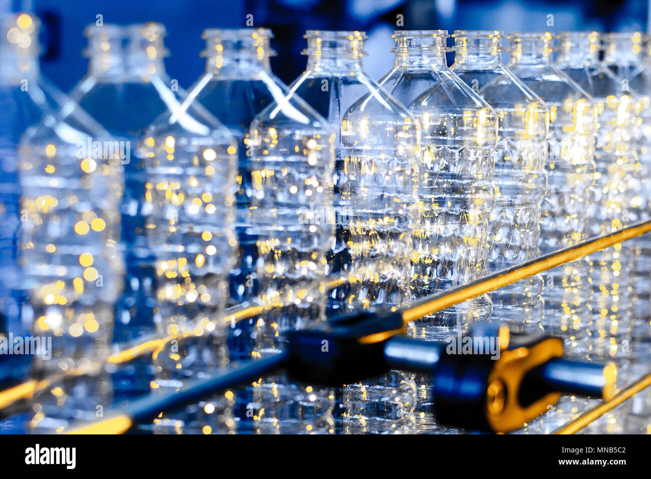 Bottle. Industrial production of plastic pet bottles. Factory line for ...