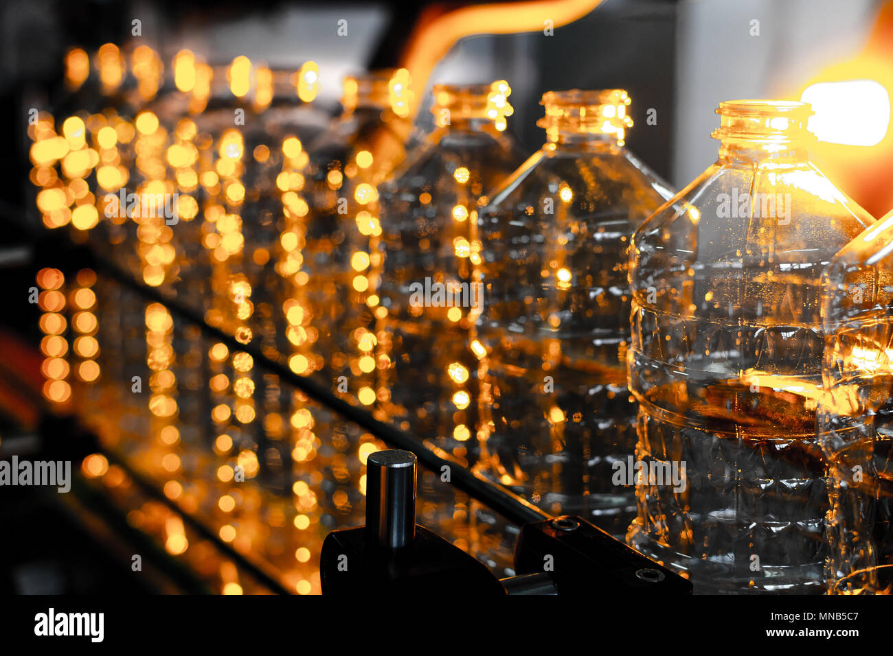 Bottle. Industrial production of plastic pet bottles. Factory line for ...