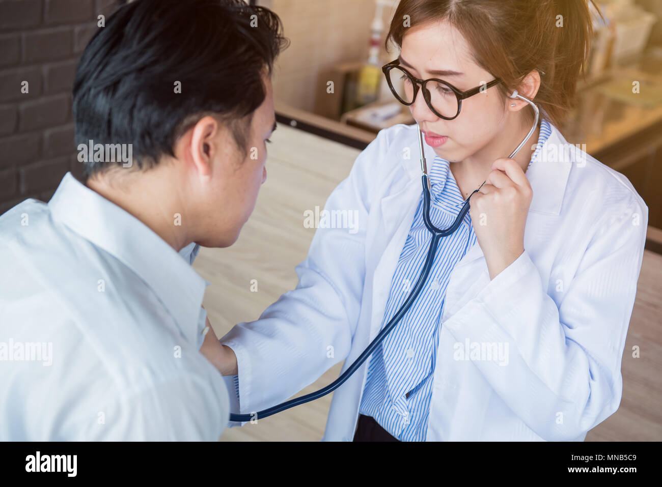 doctor, physical examination and Heart Disease Checker Stock Photo Alamy