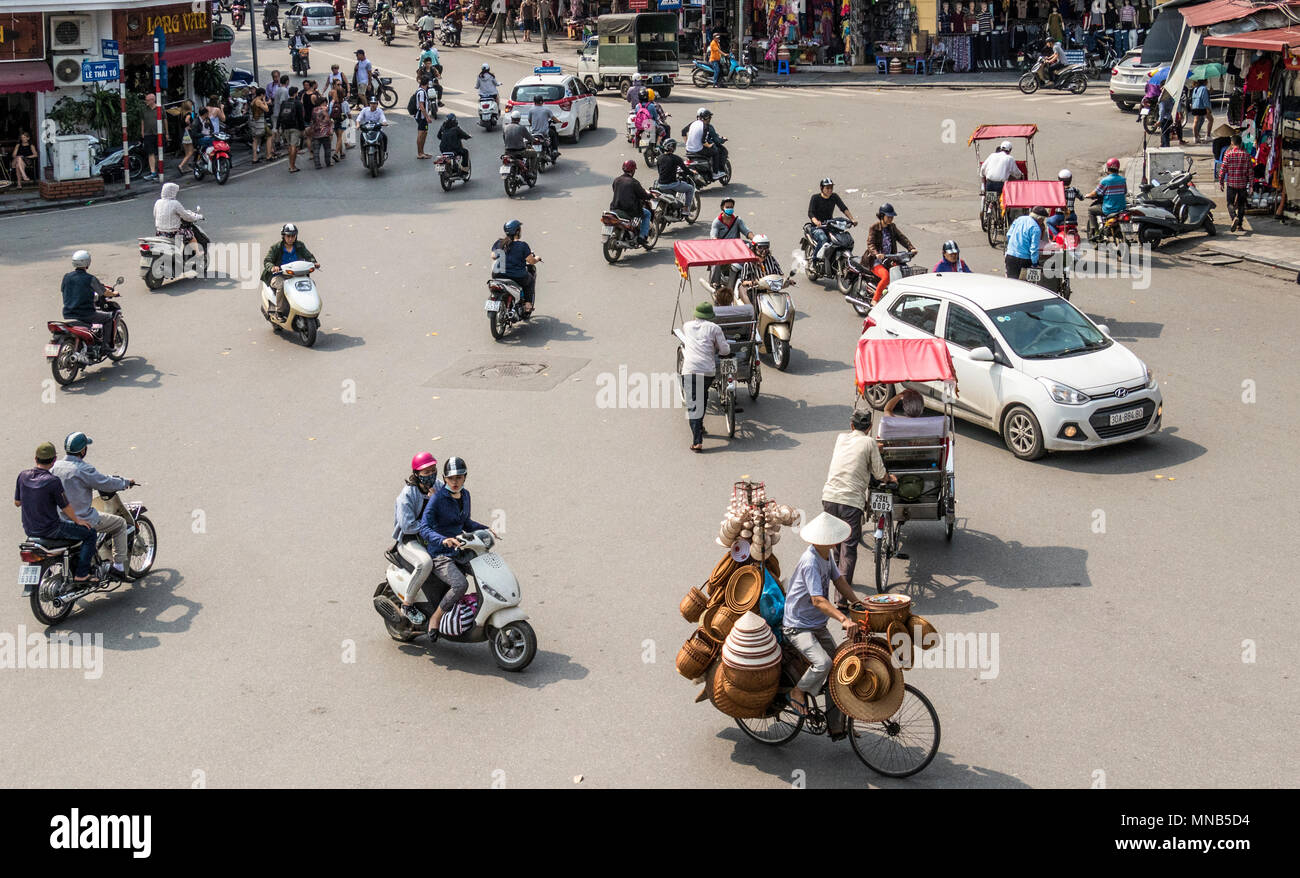 Vendors at work in city of Hanoi Vietnam Stock Photo