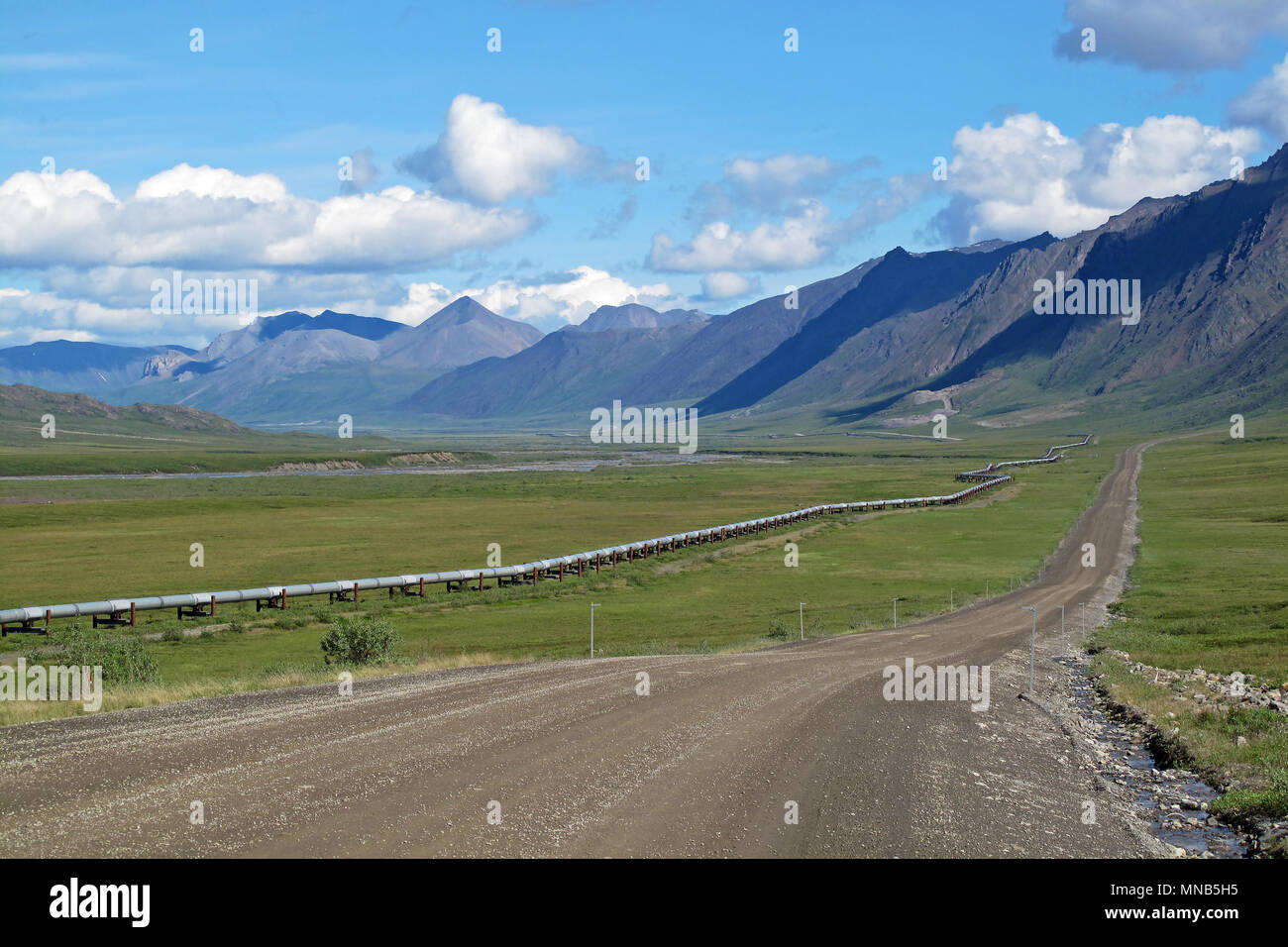 View of Dalton Highway with oil pipeline, leading from Valdez