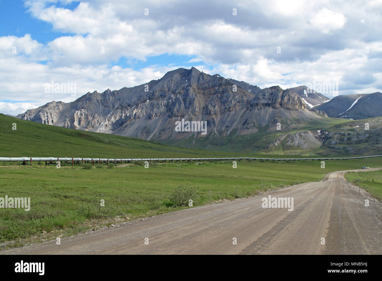 View of Dalton Highway with oil pipeline, leading from Valdez