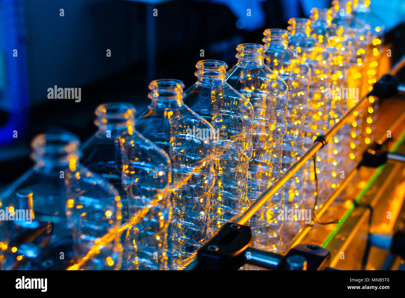 Bottle. Industrial production of plastic pet bottles. Factory line for ...