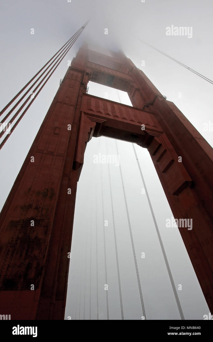 Golden Gate Bridge tower with fog rolling, San Francisco Stock Photo