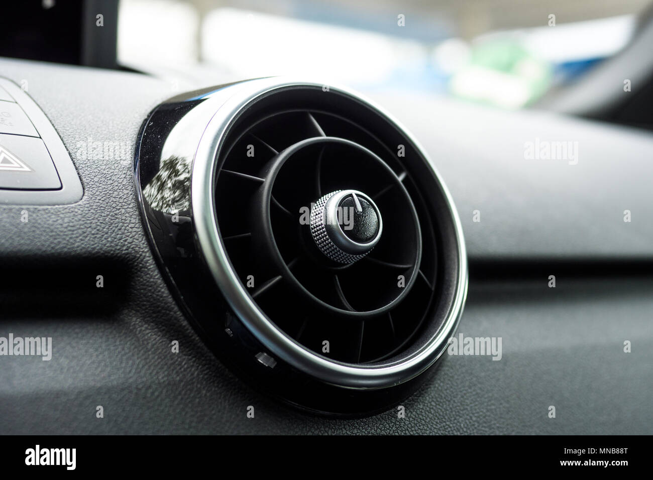 https://c8.alamy.com/comp/MNB88T/round-car-ventilation-grille-on-dashboard-of-a-modern-luxury-car-close-up-MNB88T.jpg