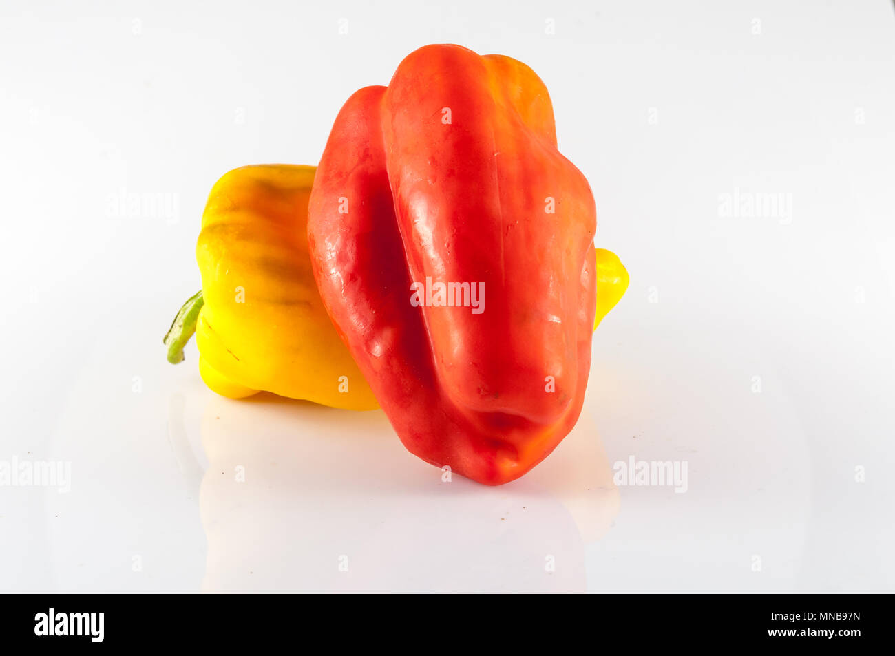 isolated red and yellow peppers on white background Stock Photo - Alamy