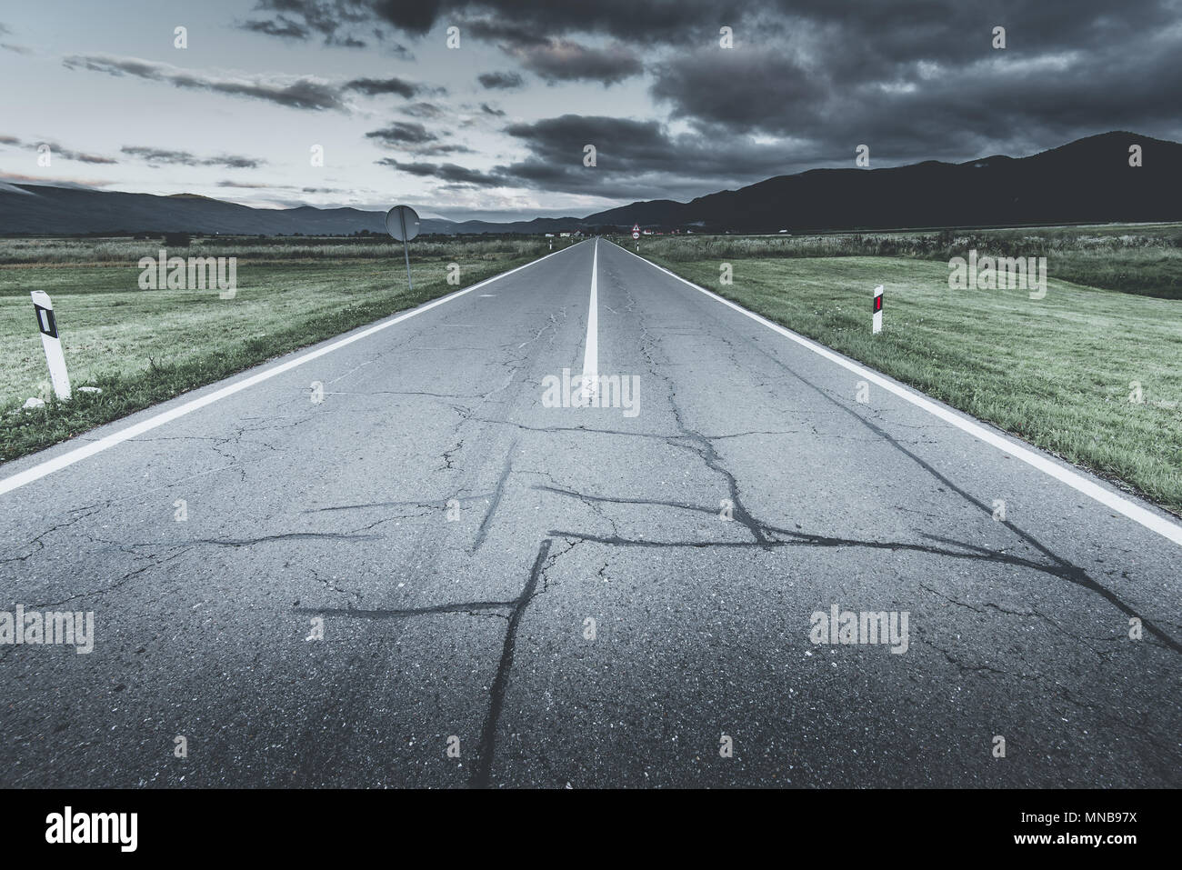 cloudy sky over country road Stock Photo - Alamy