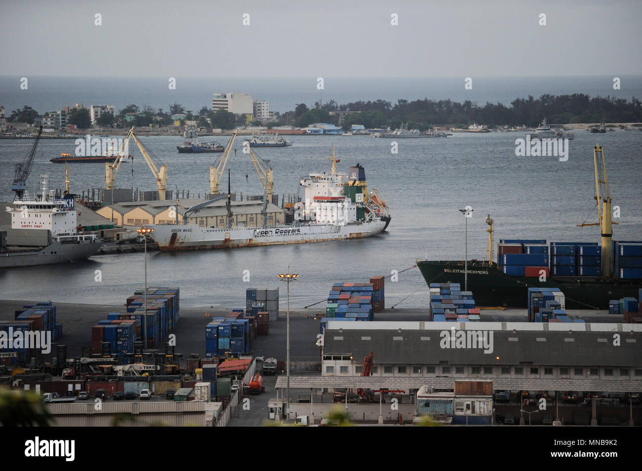ANGOLA Luanda , harbour with freight ships and docks, behind Ilha do Luanda and Ilha do Cabo Stock Photo