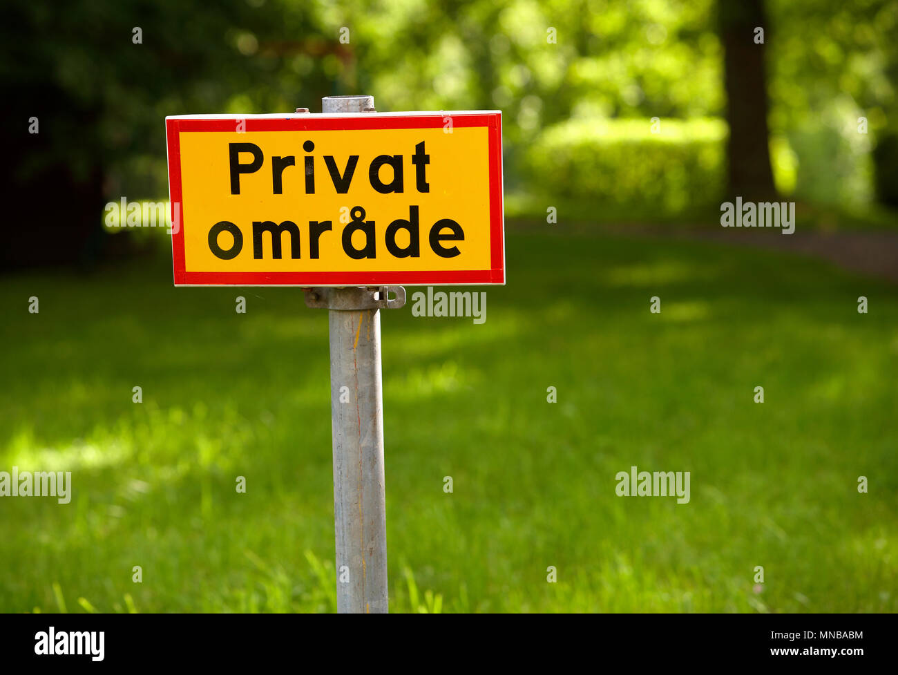 Yellow sign with red frame and text in Swedish specify Private Area. Stock Photo