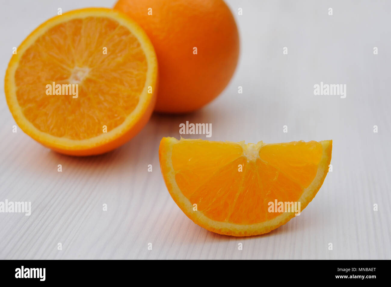 Orange sliced on wooden table Stock Photo