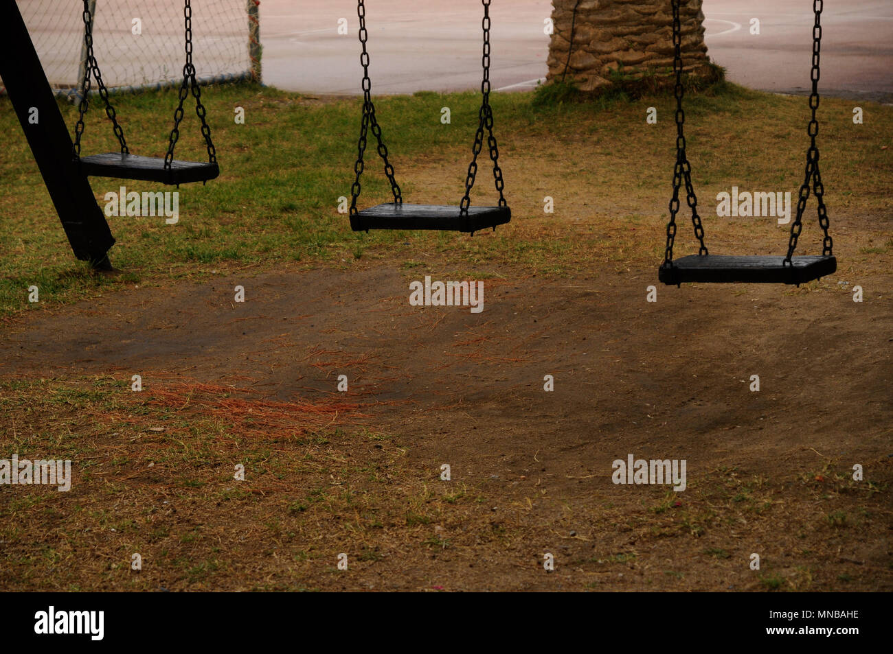 Empty swings in the park Stock Photo