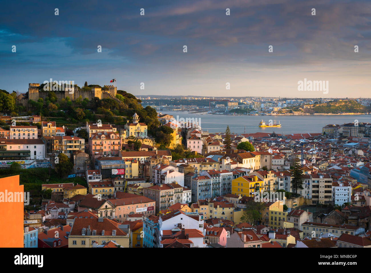 Lisbon city, view at sunset of the old town Mouraria quarter of Lisbon with the Castelo de Sao Jorge on the skyline, Portugal. Stock Photo