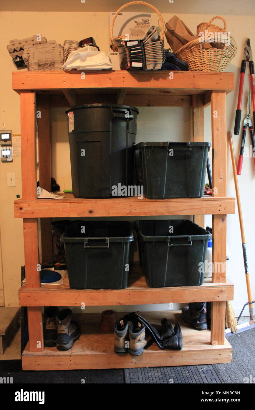 Regular wooden shelves used for storage of recyclables and other