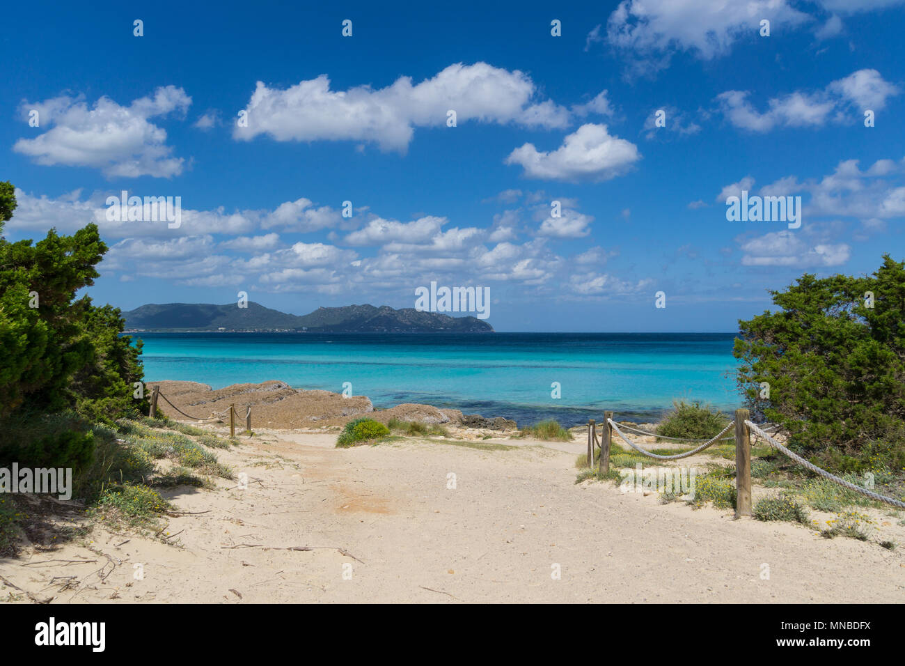 Mallorca, Sun on sand path along white sand beach in holiday region Stock Photo