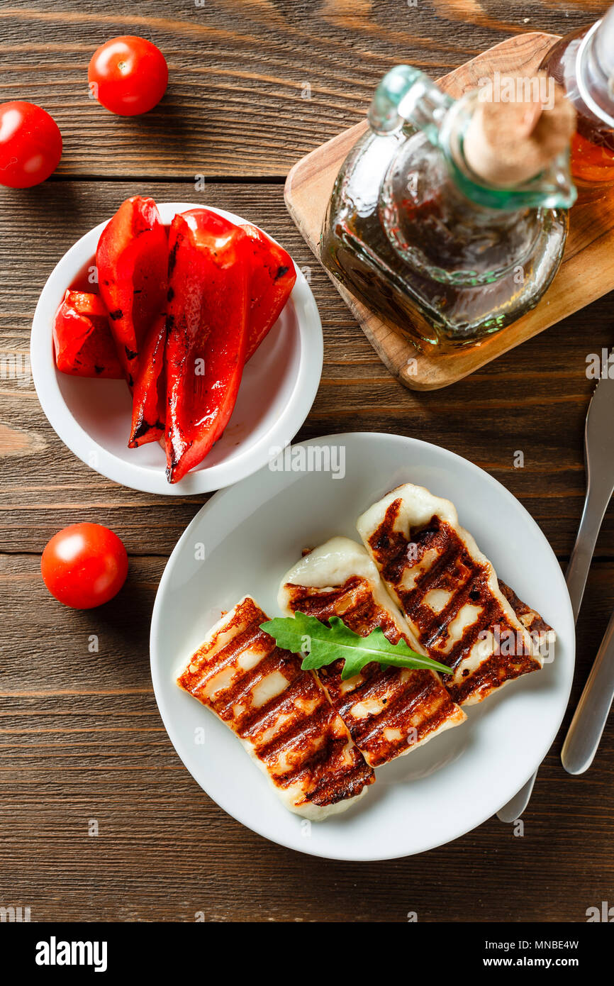 Halloumi grilled cheese with grilled bell peppers and tomatoes. Top