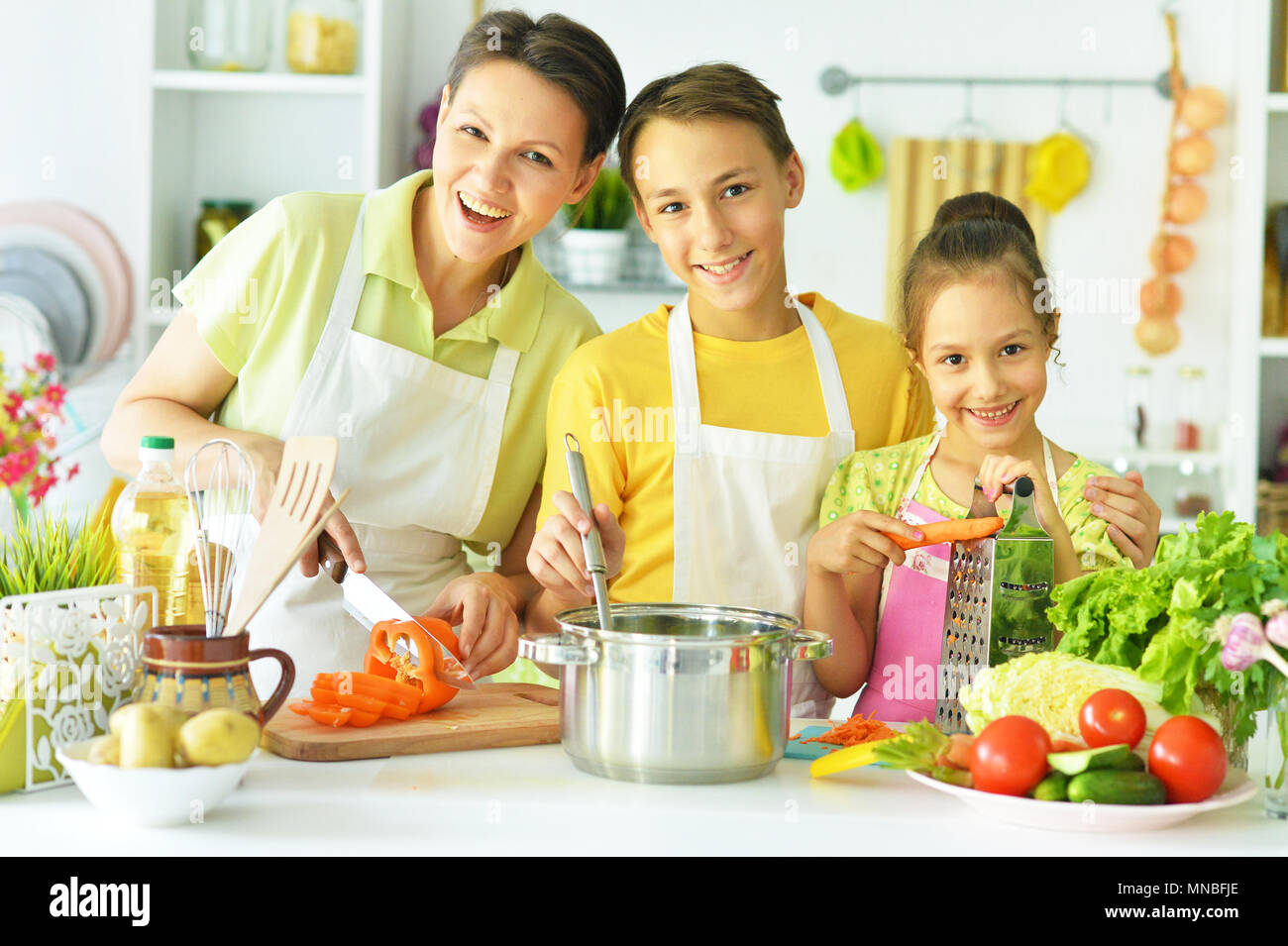 family in the kitchen Stock Photo - Alamy