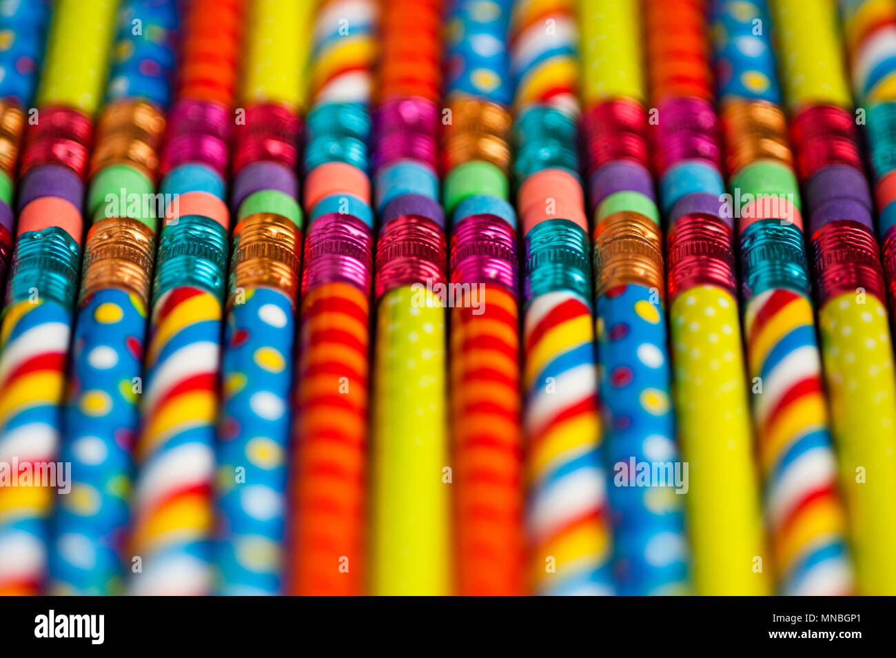 Close-up of multicolored pencils with design elements in rows Stock Photo