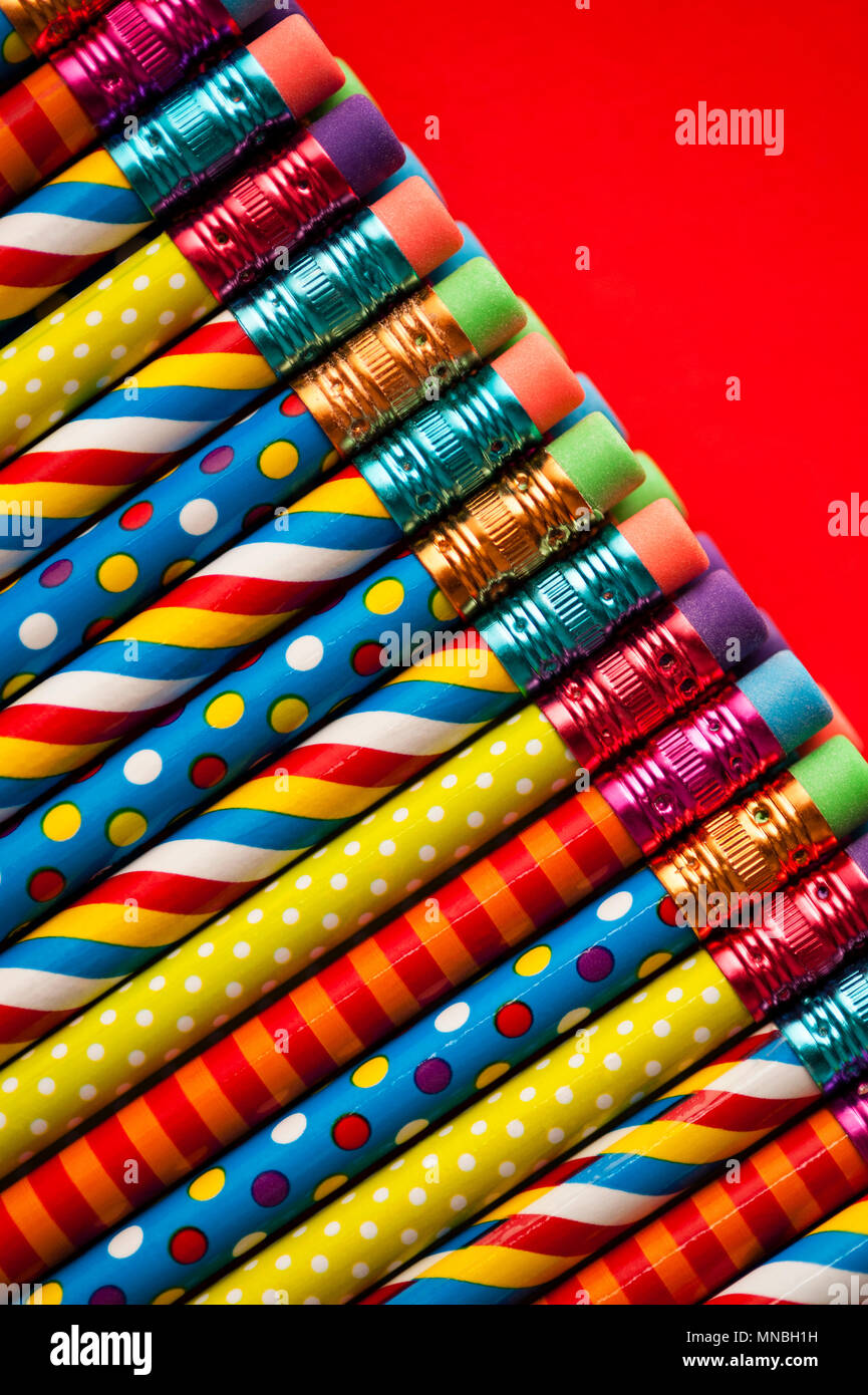Close-up of multicolored pencils with design elements in rows Stock Photo