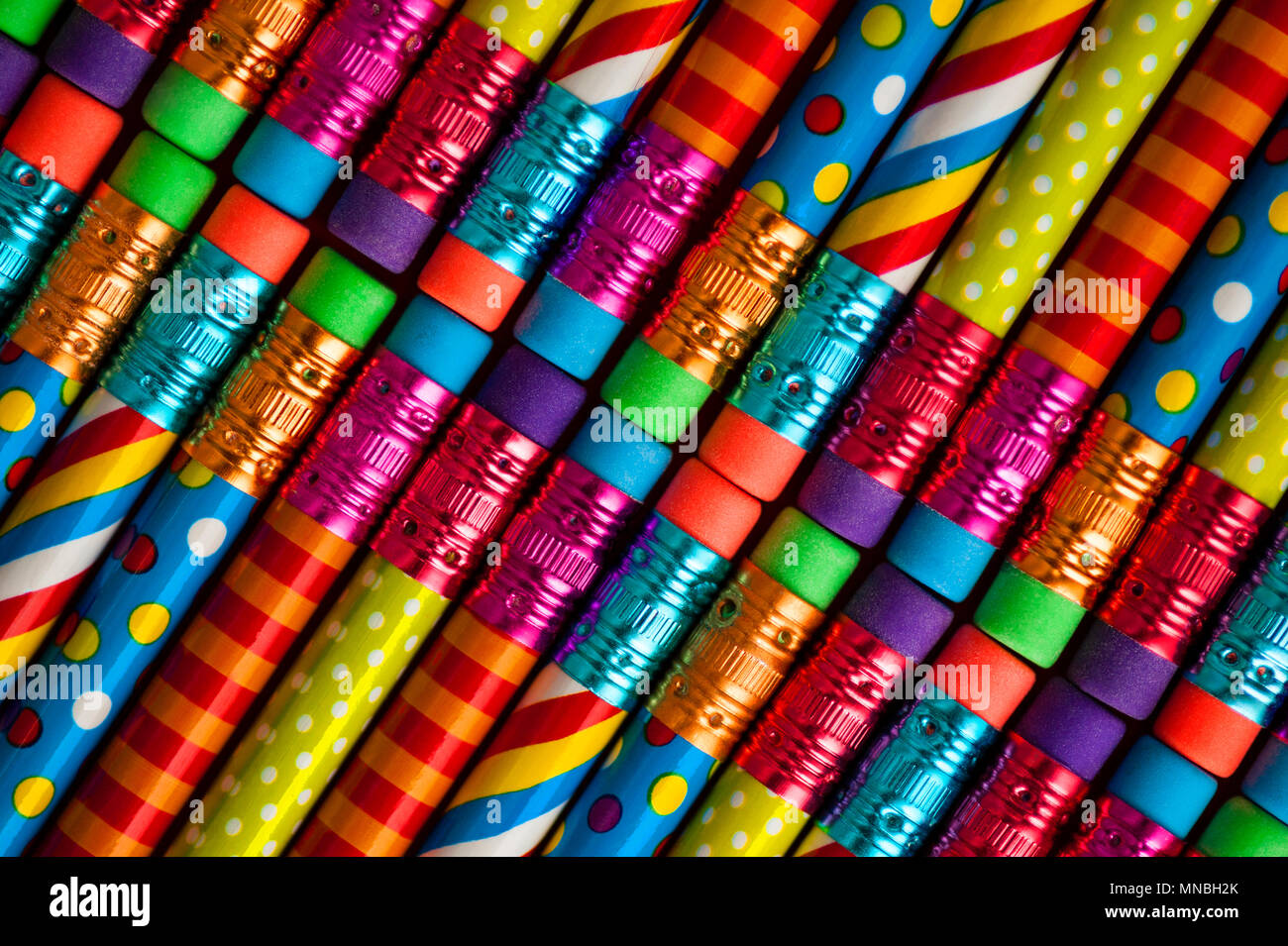 Close-up of multicolored pencils with design elements in rows Stock Photo