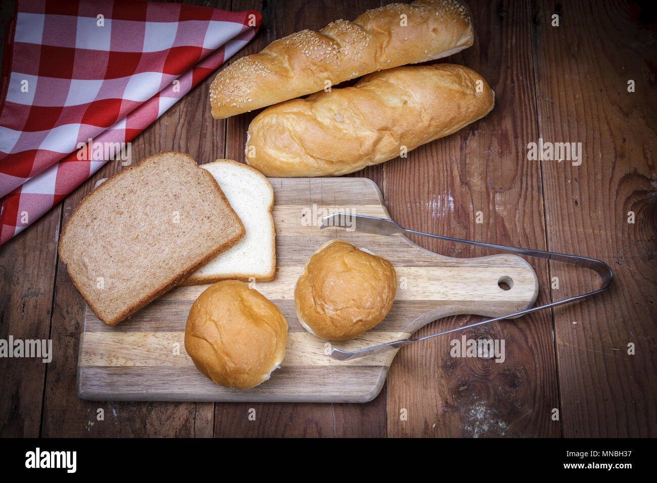 An overview of of various breads on a cutting board. Stock Photo