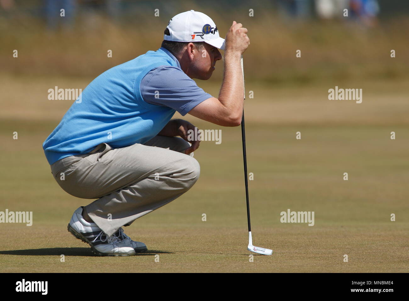 MUIRFIELD, SCOTLAND - JULY 20: Justin Leonard studying his putt at the 1st green during the third round of The Open Championship 2013 at Muirfield Golf Club on July 20, 2013 in Scotland. Stock Photo