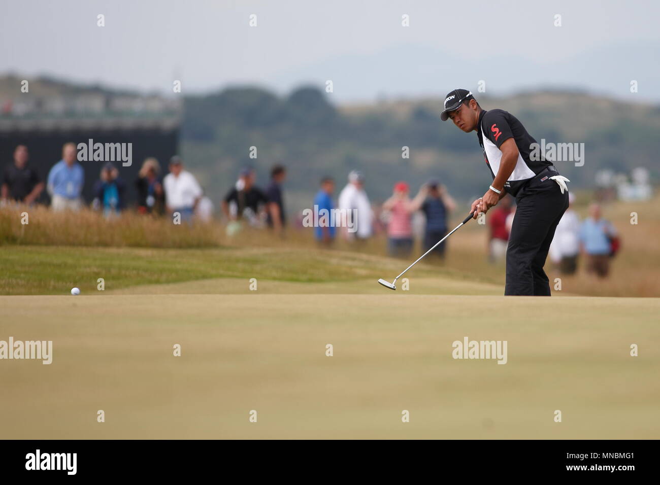 MUIRFIELD, SCOTLAND - JULY 18: Hideki Matsuyama birdie putt at the 5th green during the first round of The Open Championship 2013 at Muirfield Golf Club on July 18, 2013 in Scotland. Stock Photo