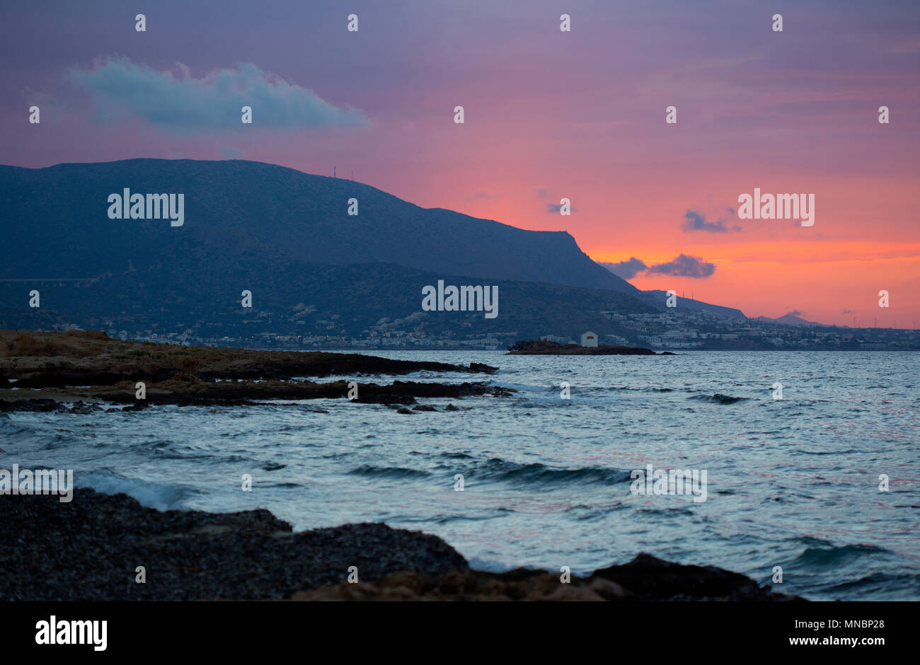 View of Afentis Christos island near to Malia Stock Photo