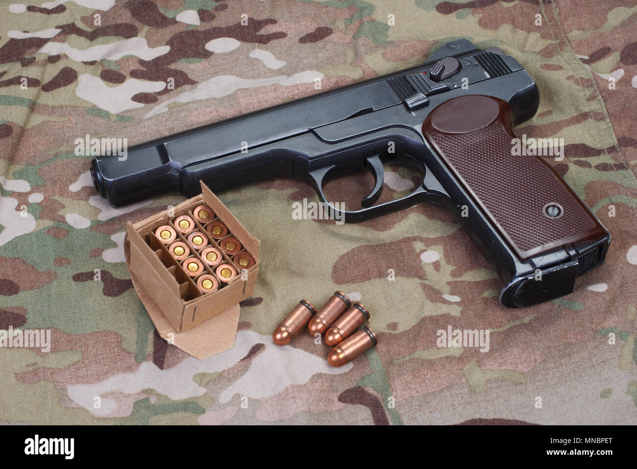Stechkin automatic pistol APS on camouflage background Stock Photo - Alamy