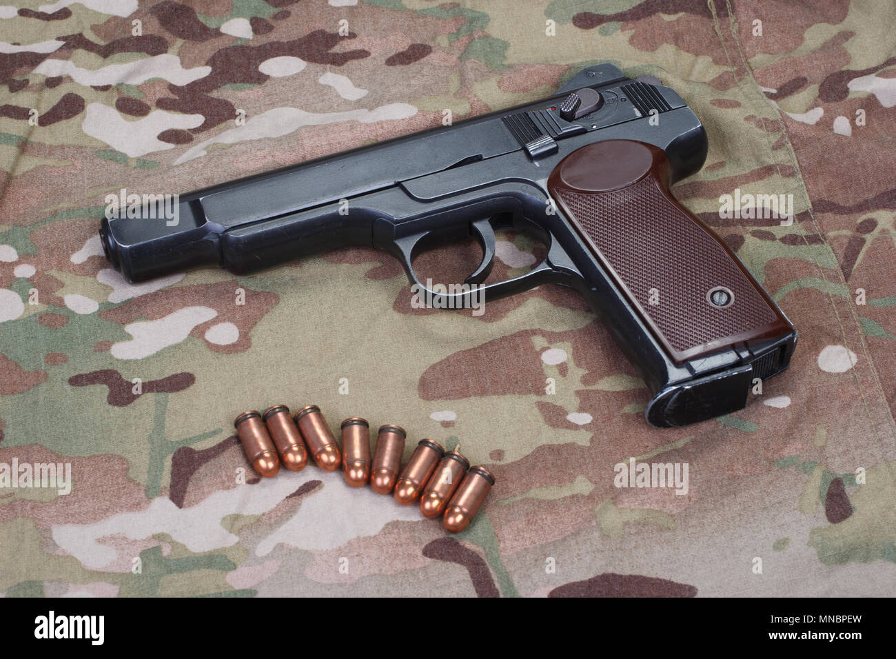Stechkin automatic pistol APS on camouflage background Stock Photo - Alamy
