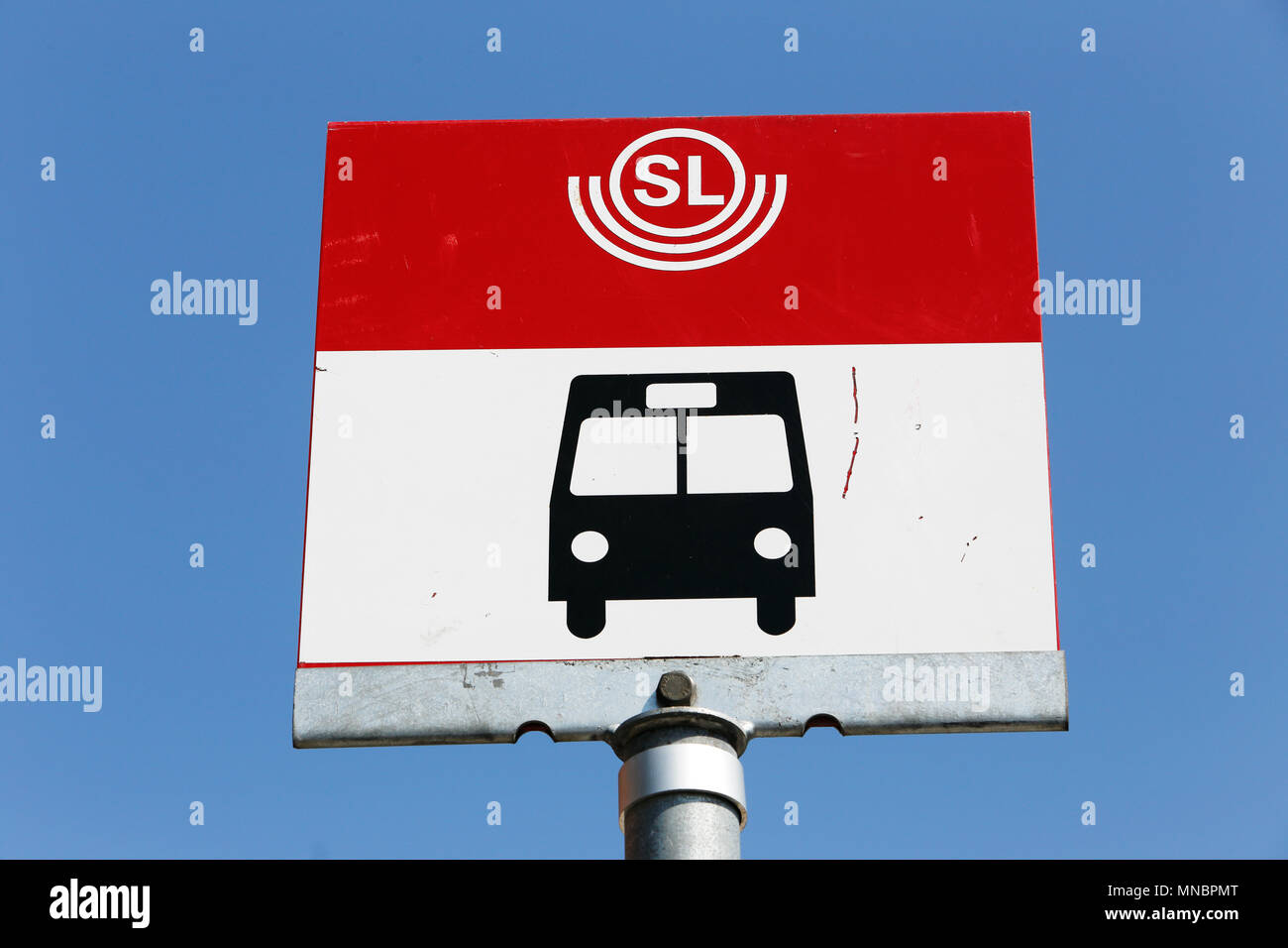 Stockholm, Sweden - July 8, 2014: Close-up of a Stockholm public transport, SL, bus stop with a bus symbol against the blue sky. Stock Photo