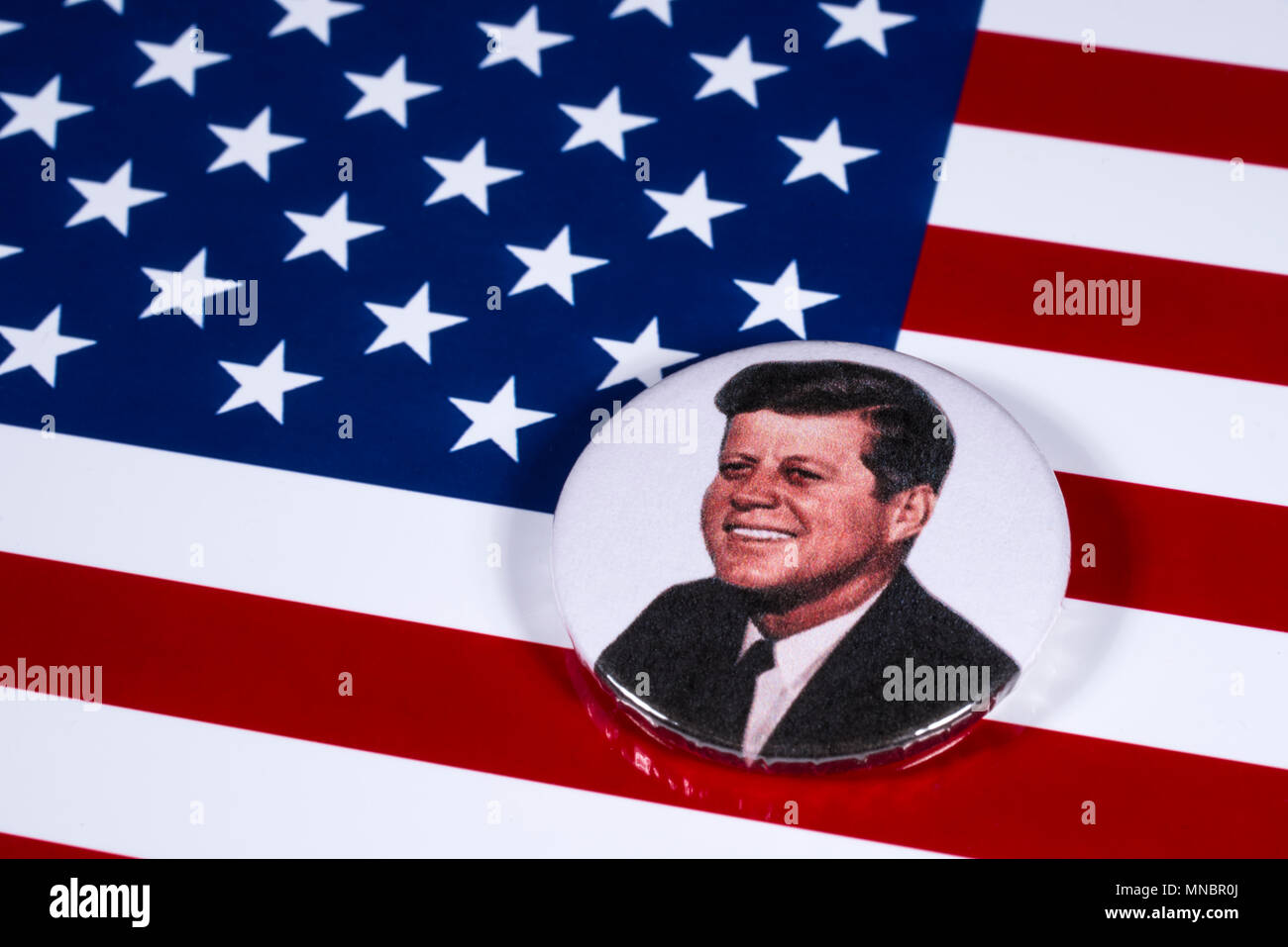 LONDON, UK - APRIL 27TH 2018: A John F. Kennedy badge pictured over the USA Flag, on 27th April 2018.  John F Kennedy was the 35th President of the Un Stock Photo