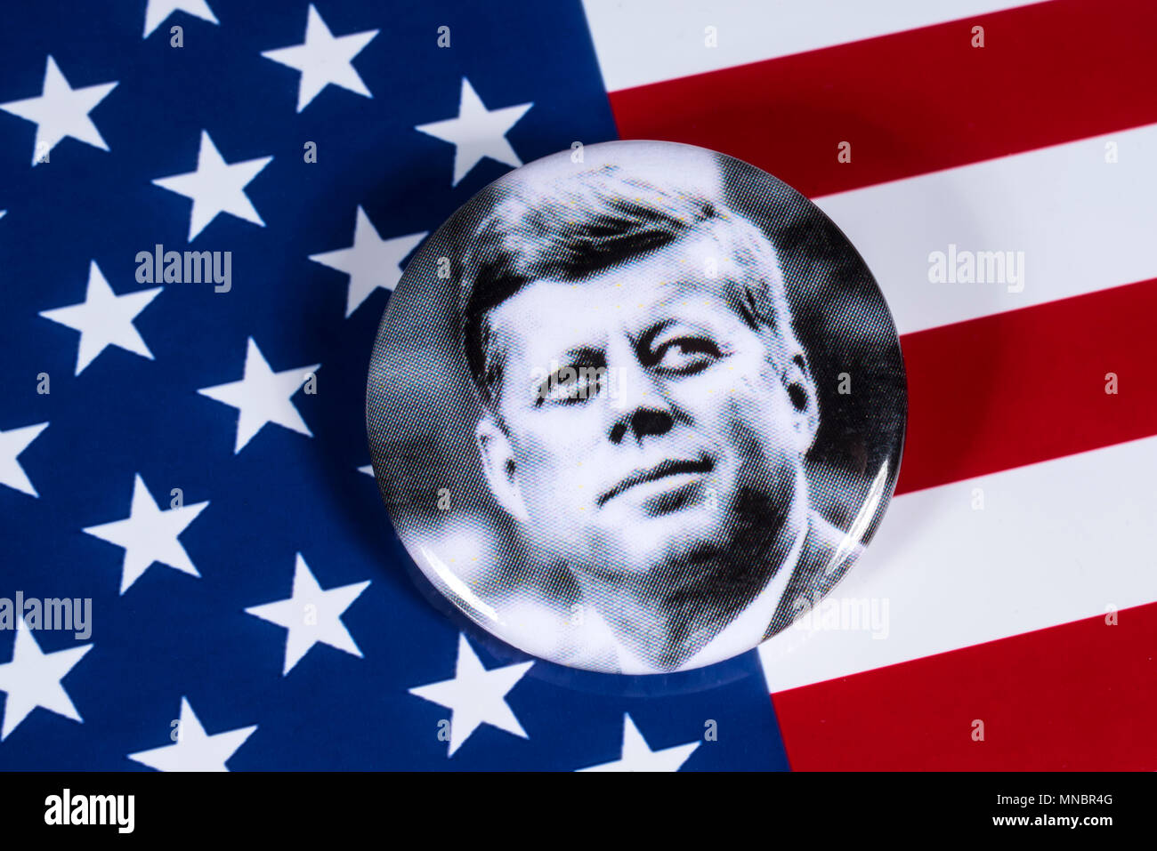 LONDON, UK - APRIL 27TH 2018: A John F. Kennedy badge pictured over the USA Flag, on 27th April 2018.  John F Kennedy was the 35th President of the Un Stock Photo