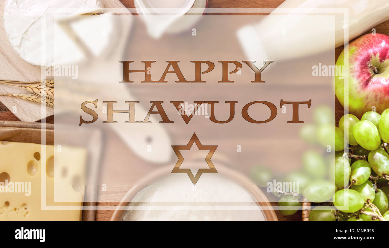 Rustic style tabletop with fruits and dairy products for Shavuot celebration Stock Photo