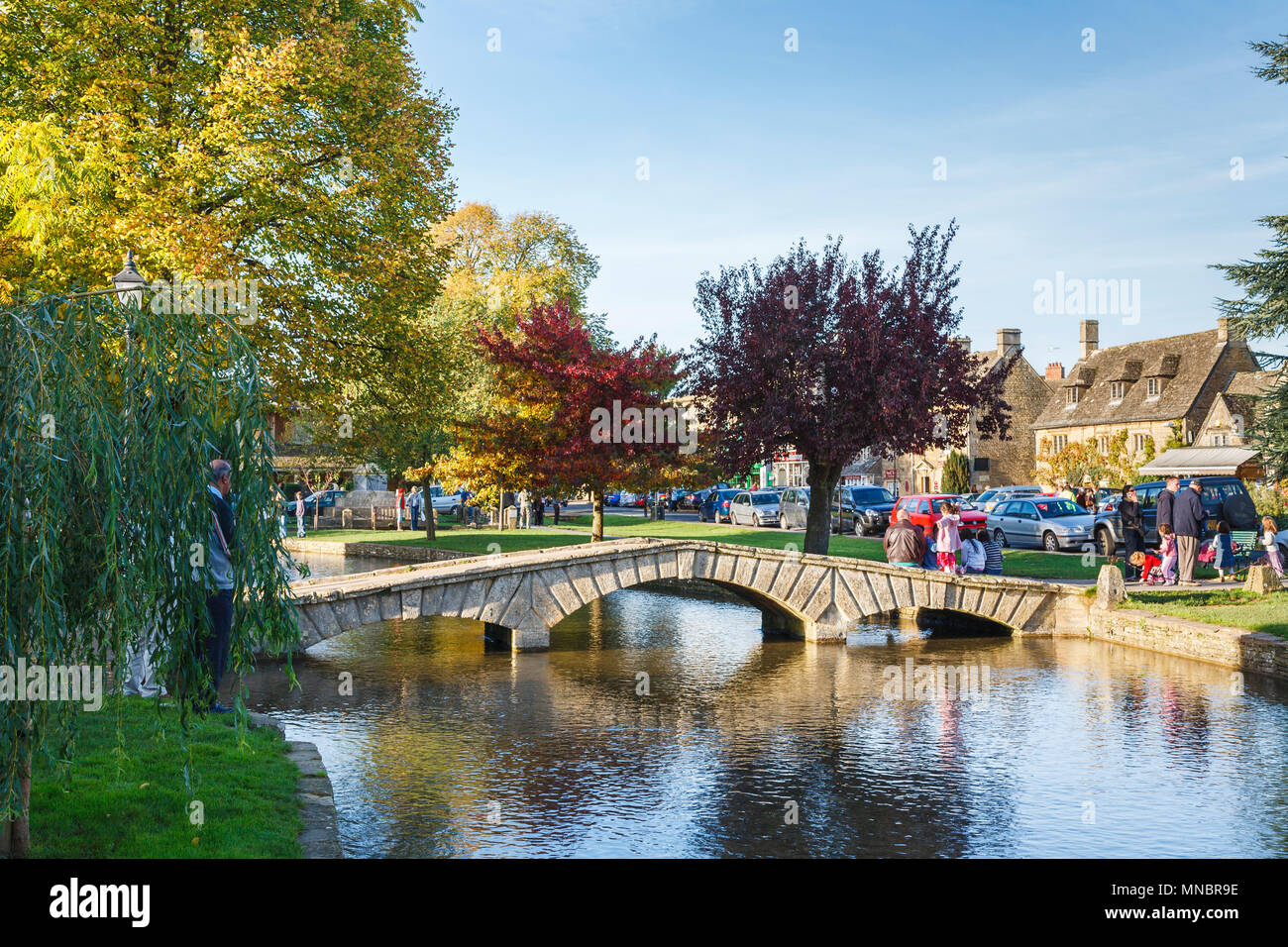 Cotswold village: Historic stone bridge over the River Windrush in the ...