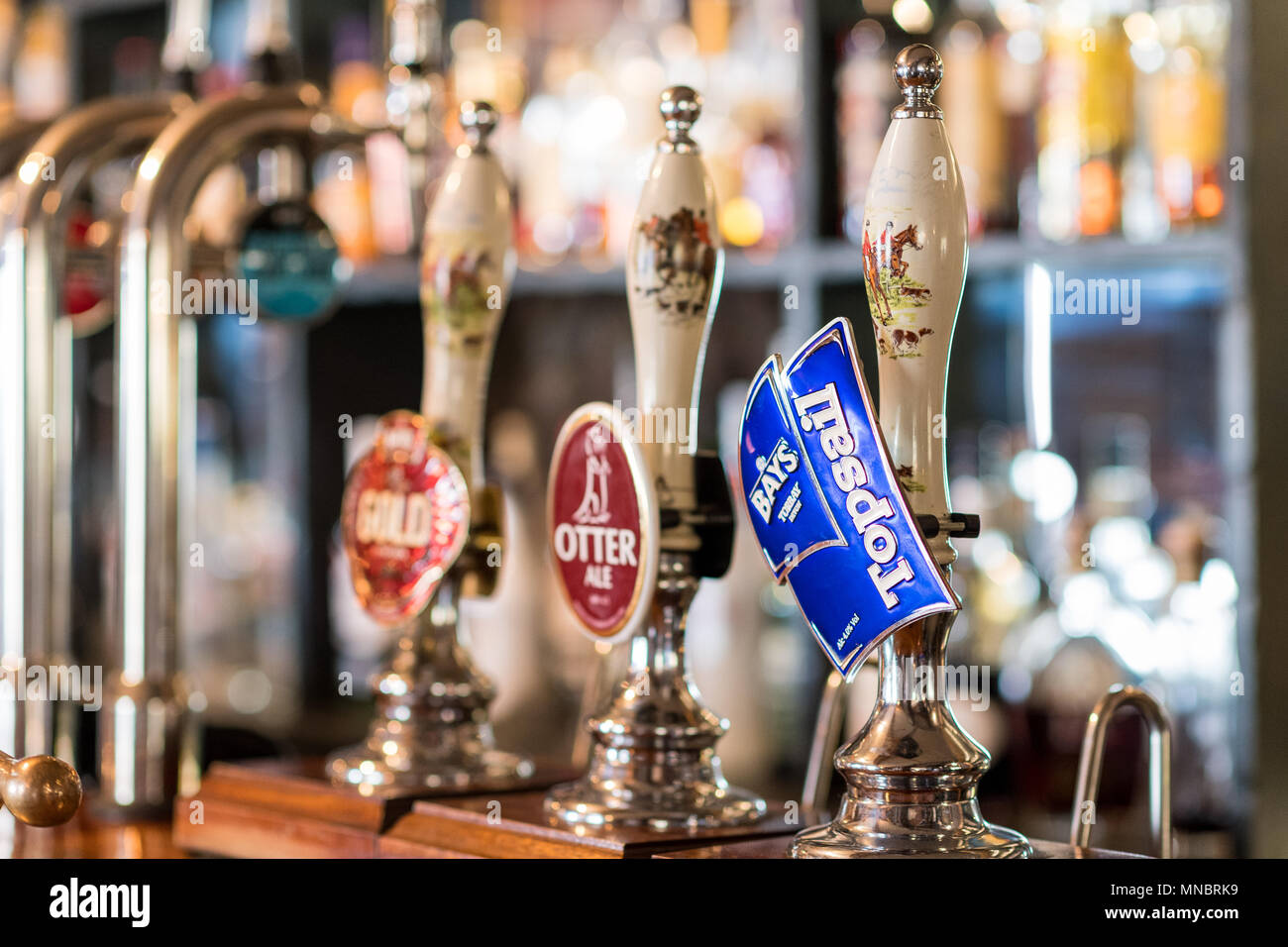 A traditional English pub bar with cask pumps Stock Photo