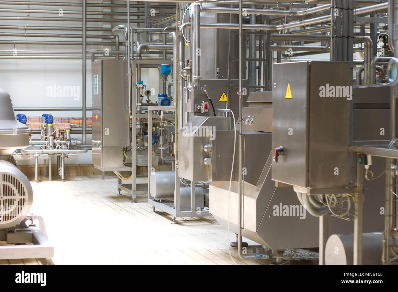Dairy Plant. Conveyor with milk  bottles. Stock Photo