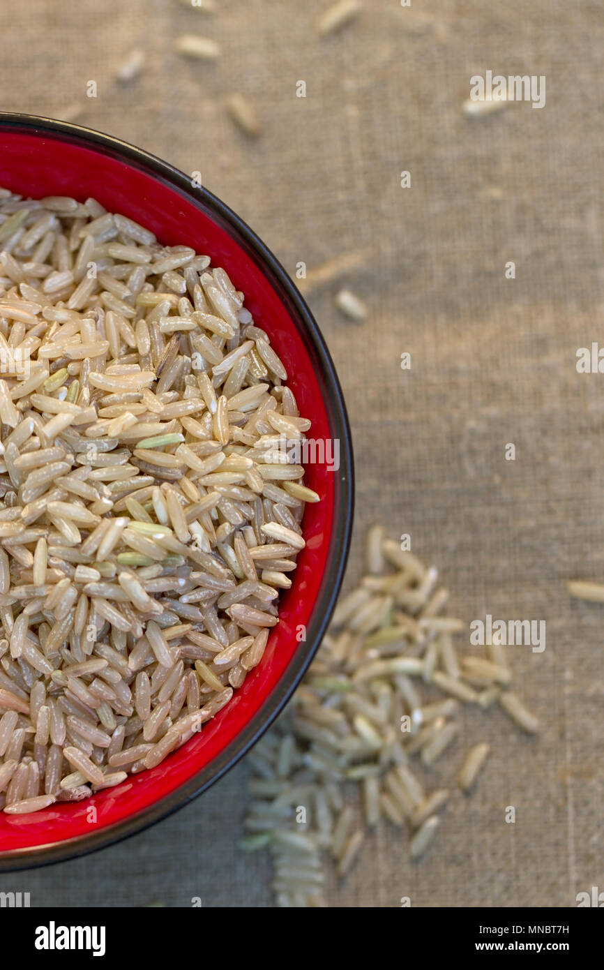 Rawfields Brown Rice Raw brown rice in a bowl Stock Photo - Alamy