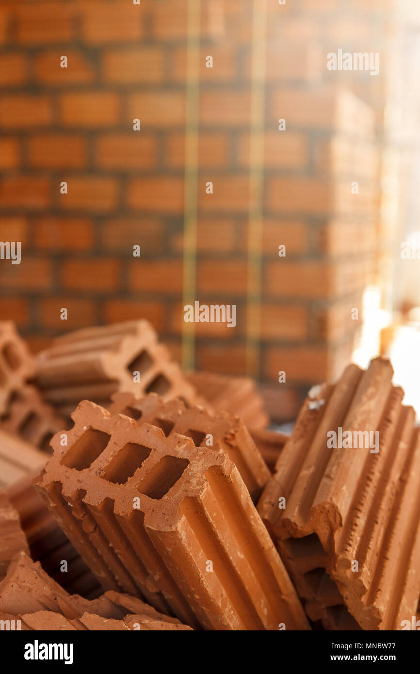 Close up of pile of red clay bricks in construction site Stock Photo ...