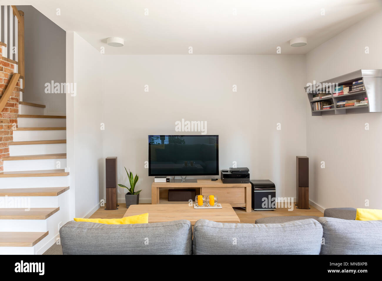 Open Living Room With Tv Sofa And Staircase Stock Photo Alamy