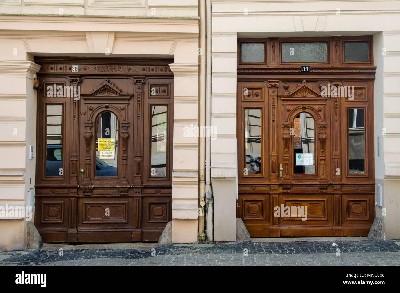 Two similar ancient decorated doors in Gorlitz, Germany Stock Photo Alamy