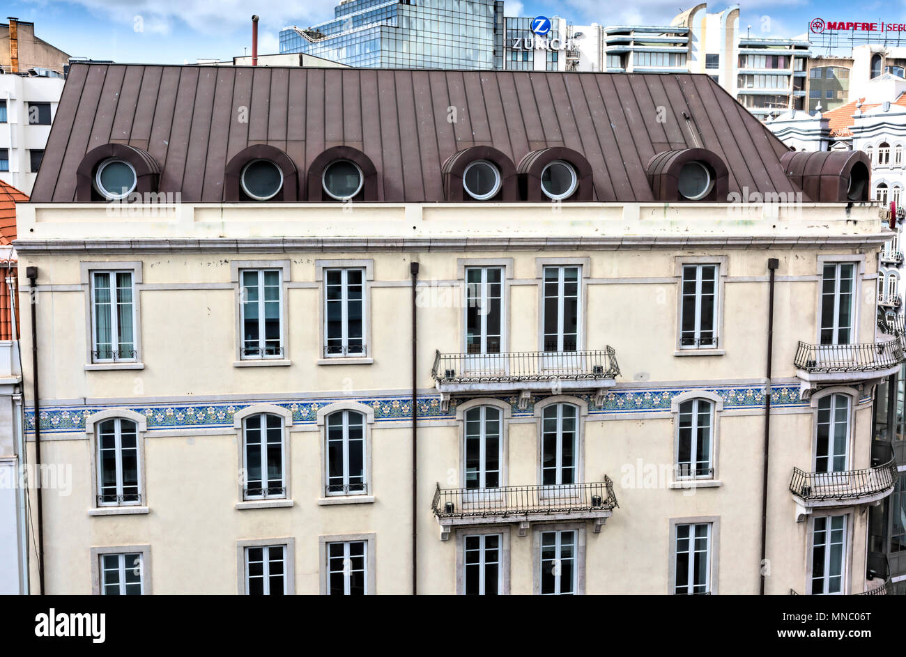 Attractive office block on Rua Duque de Palmela in Lisbon with unusual metalled roof Stock Photo