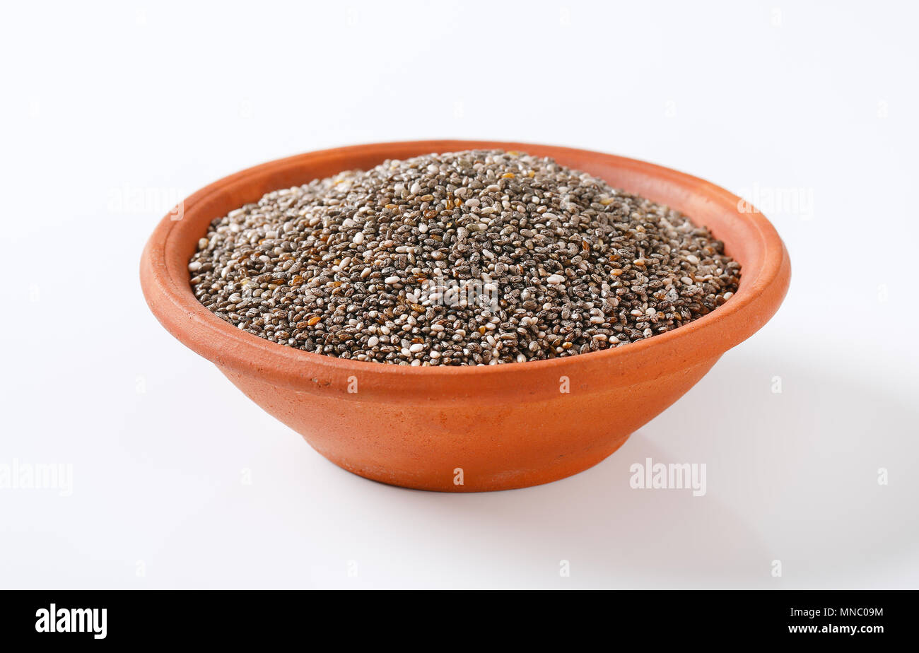 bowl of healthy chia seeds on white background Stock Photo